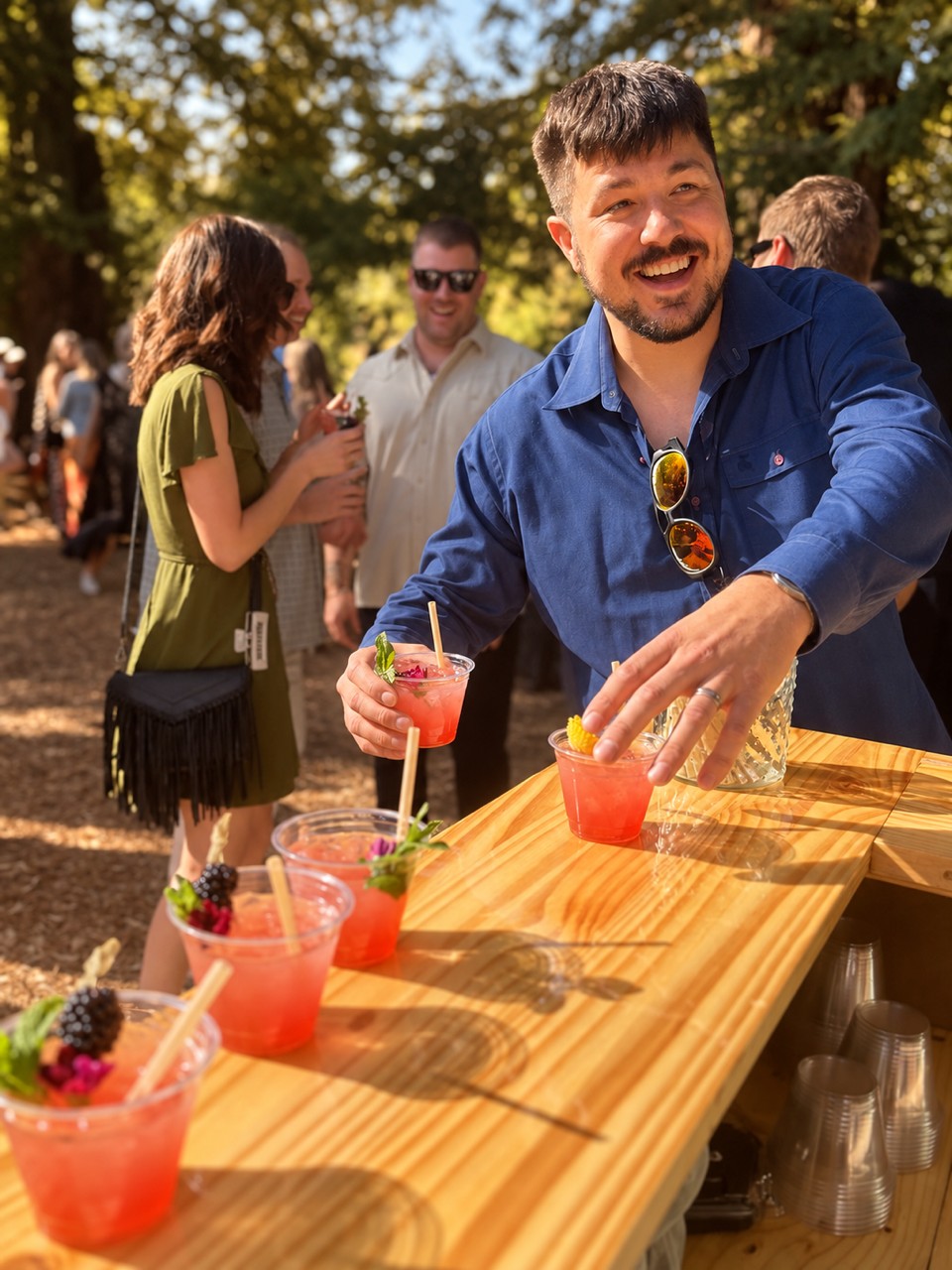 Wedding guest enjoying a pink cocktail
