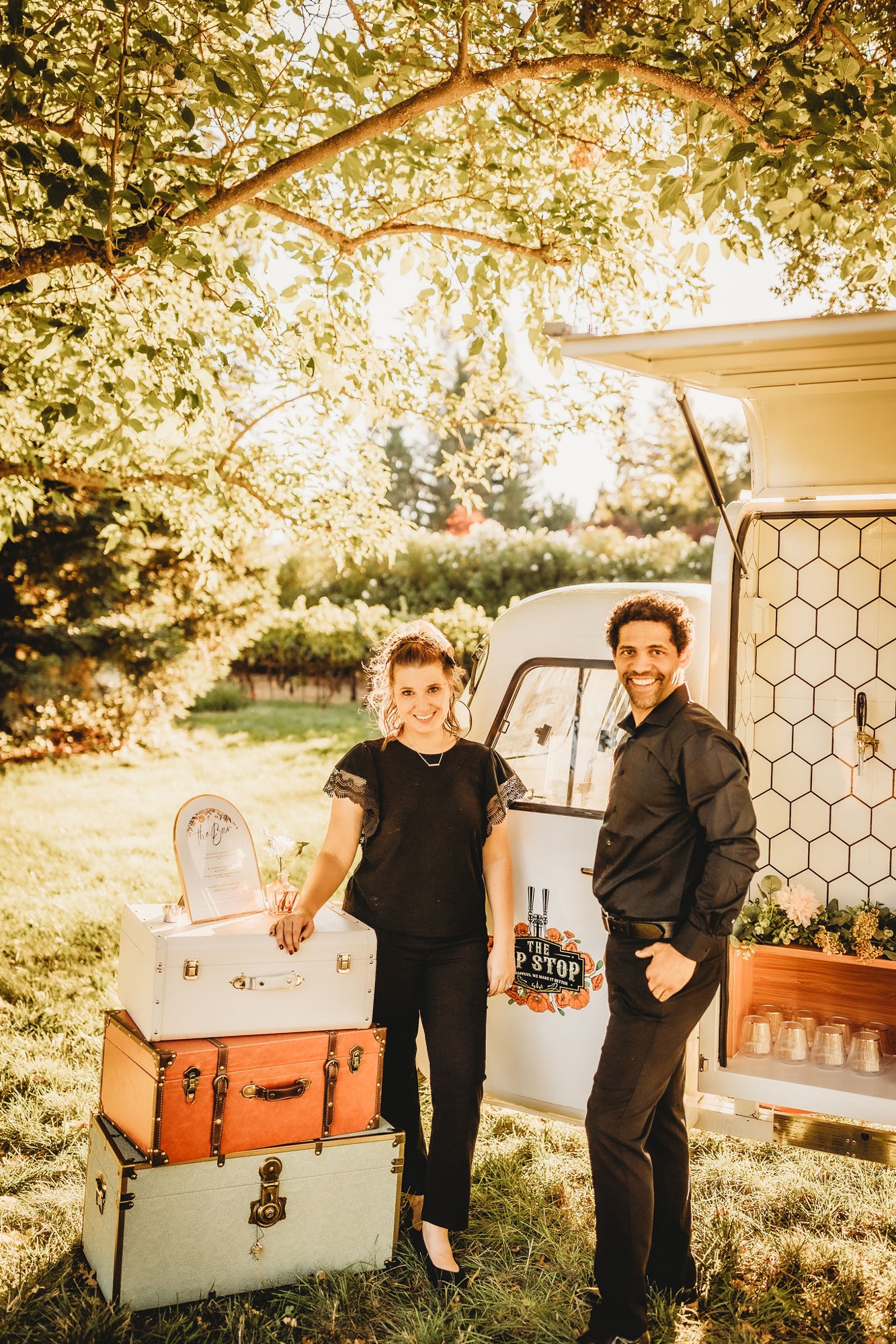 Jessica and Jorge beside The Sip Stop Piaggio mobile bar